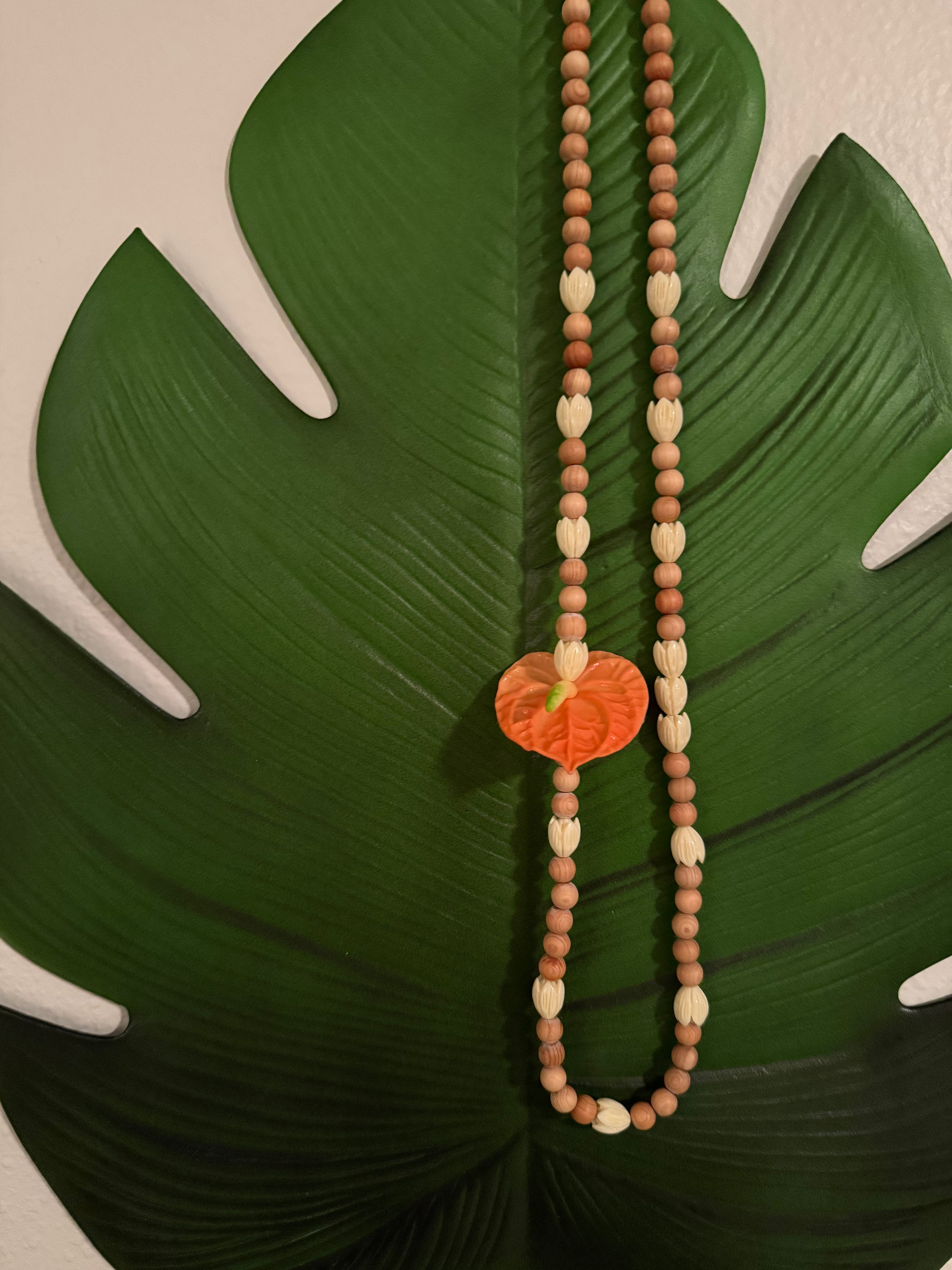 Anthurium (1) Orange Pikake w/ Cedar